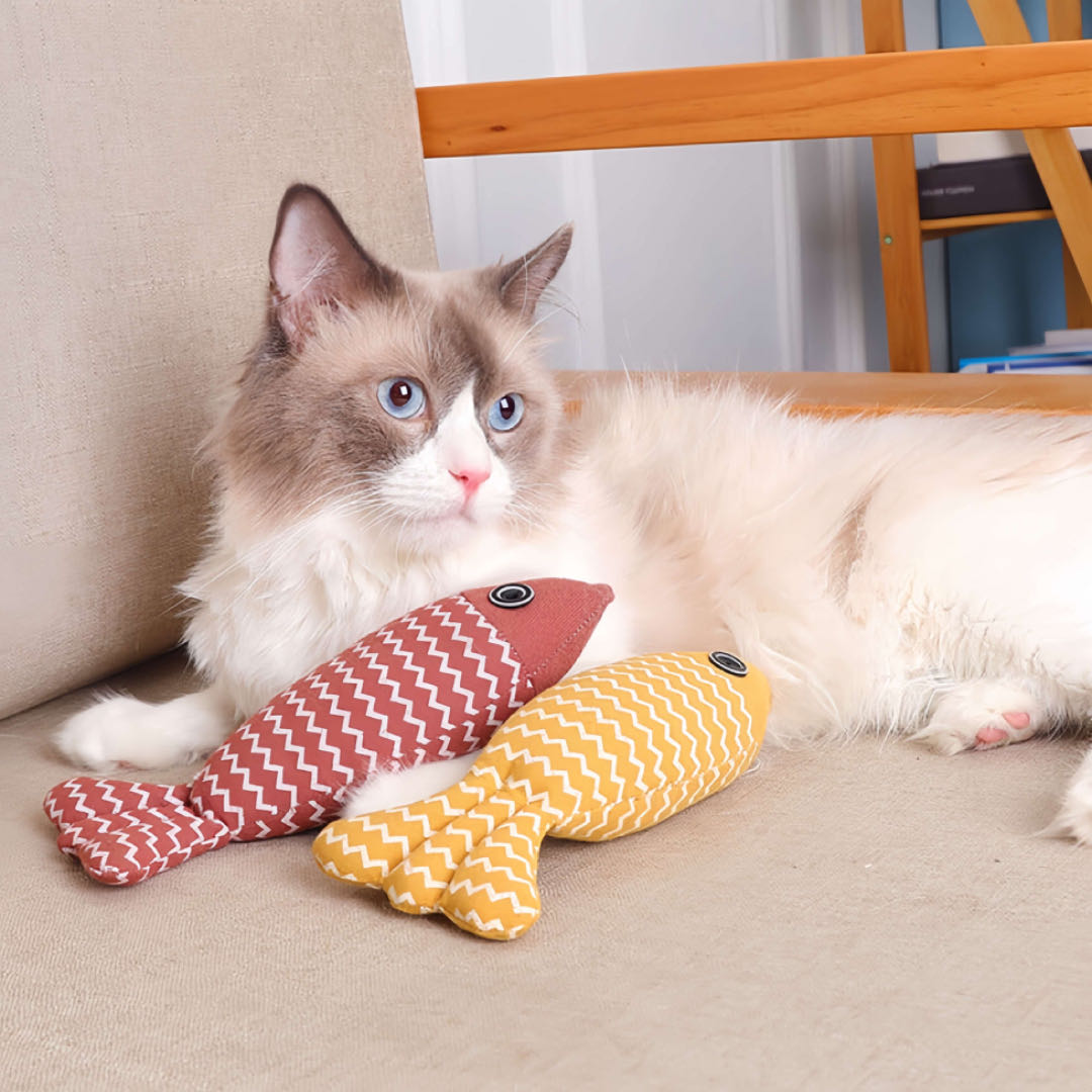 A Cat Plays Two Stuffed Fish Cat Toy With Catnip petvibez