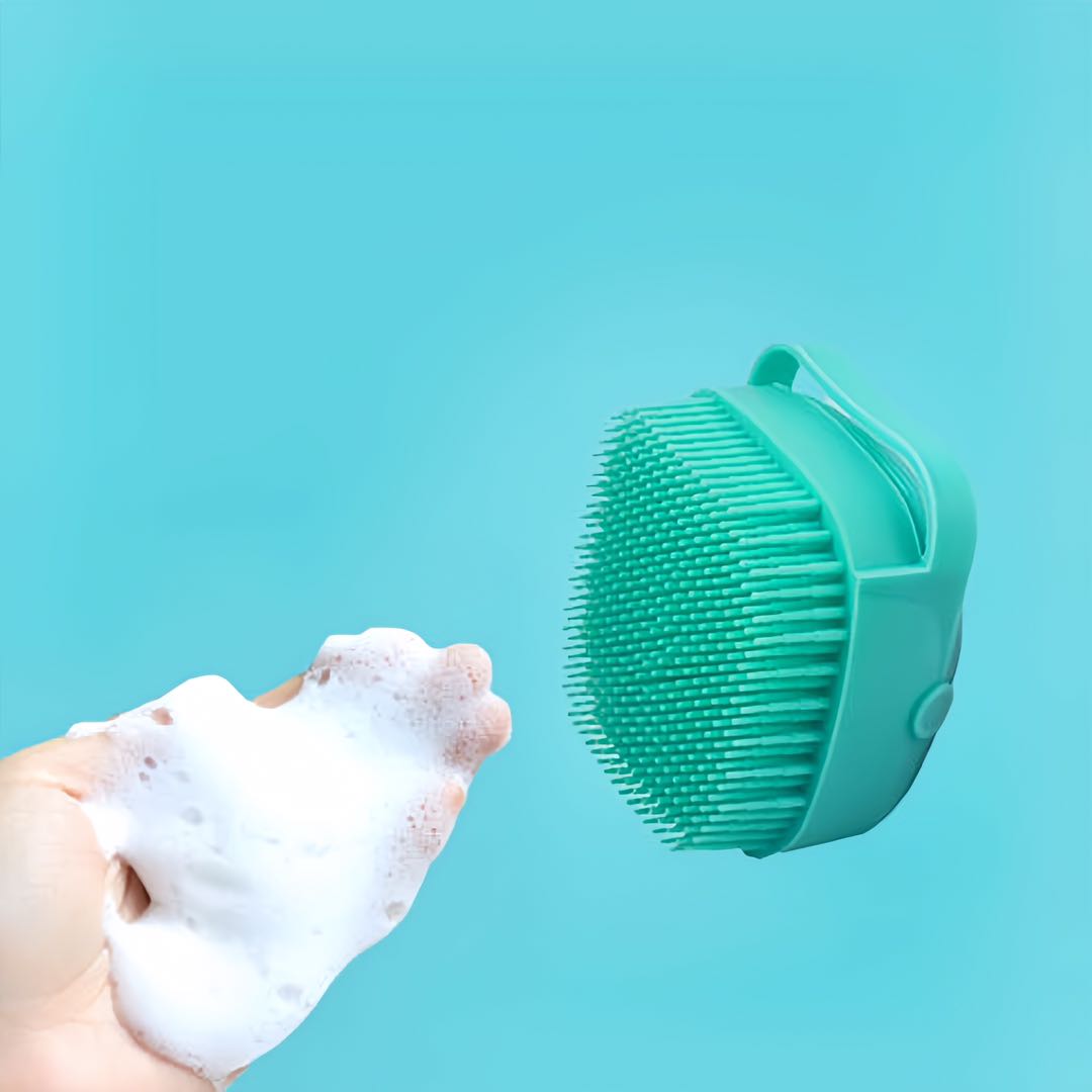 Squeeze the foam out of a pet silicon bathing brush on the hand petvibez