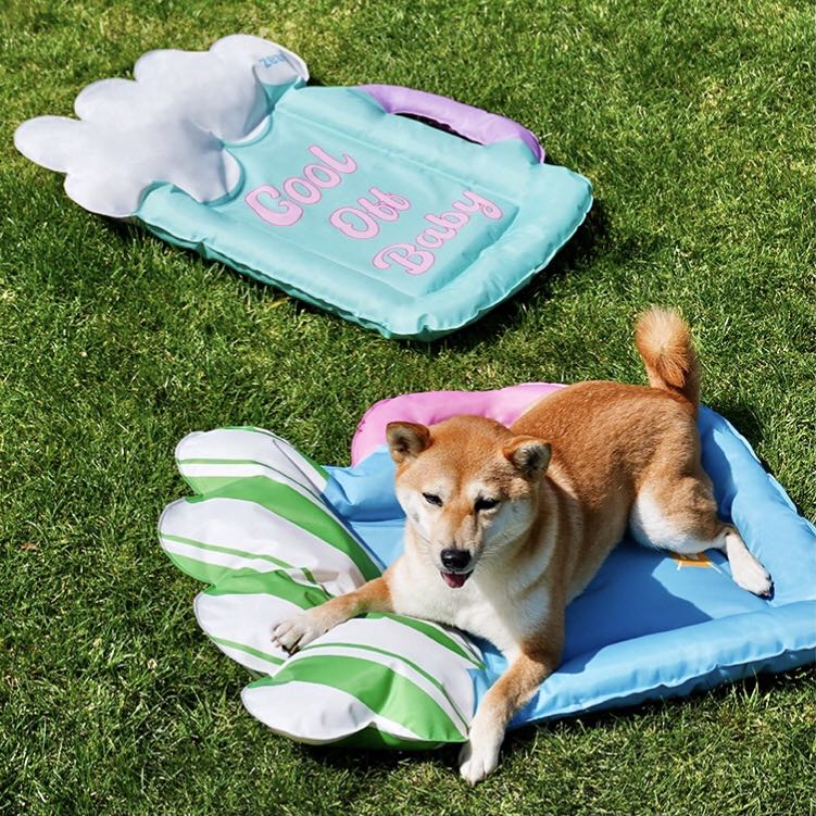 A Dog Lying On A Blue Colour Beer Cup Shaped Pet Cooling Mat