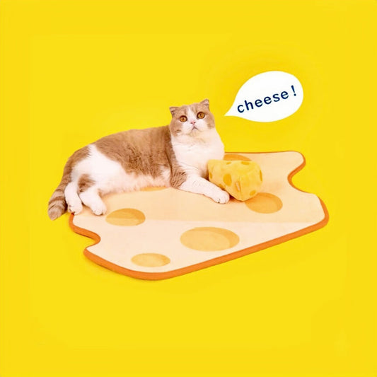 A Cat Lying On A Cheesecake Shaped Pet Sleeping Mat