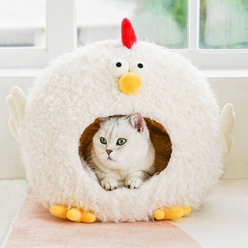 A Cat In A Chick Cluck Style Cat House Bed