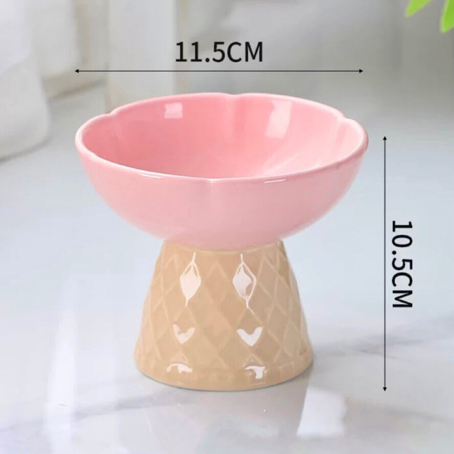 A Pink Colour Ceramic Pet Bowl With Ice Cream Cone Base And Round Bowl